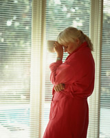 frustrated woman by window