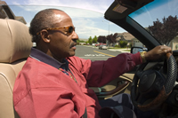 man driving convertible with top down 