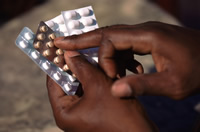 man pointing to medication